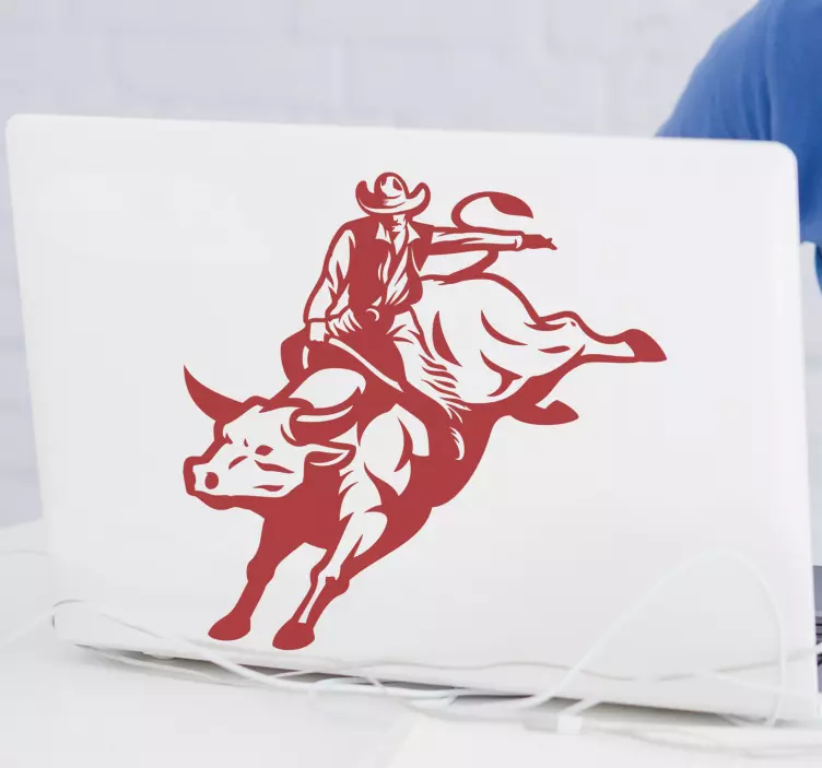 Cowboy lovaglás egy bika laptop matrica - TenStickers